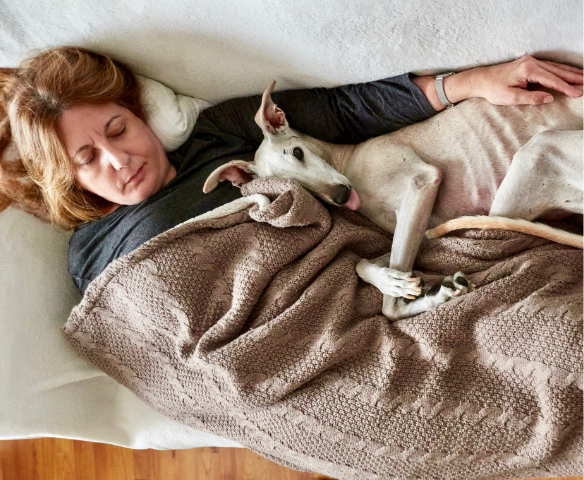 lady and her dog napping