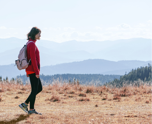 lady hiking in a plain